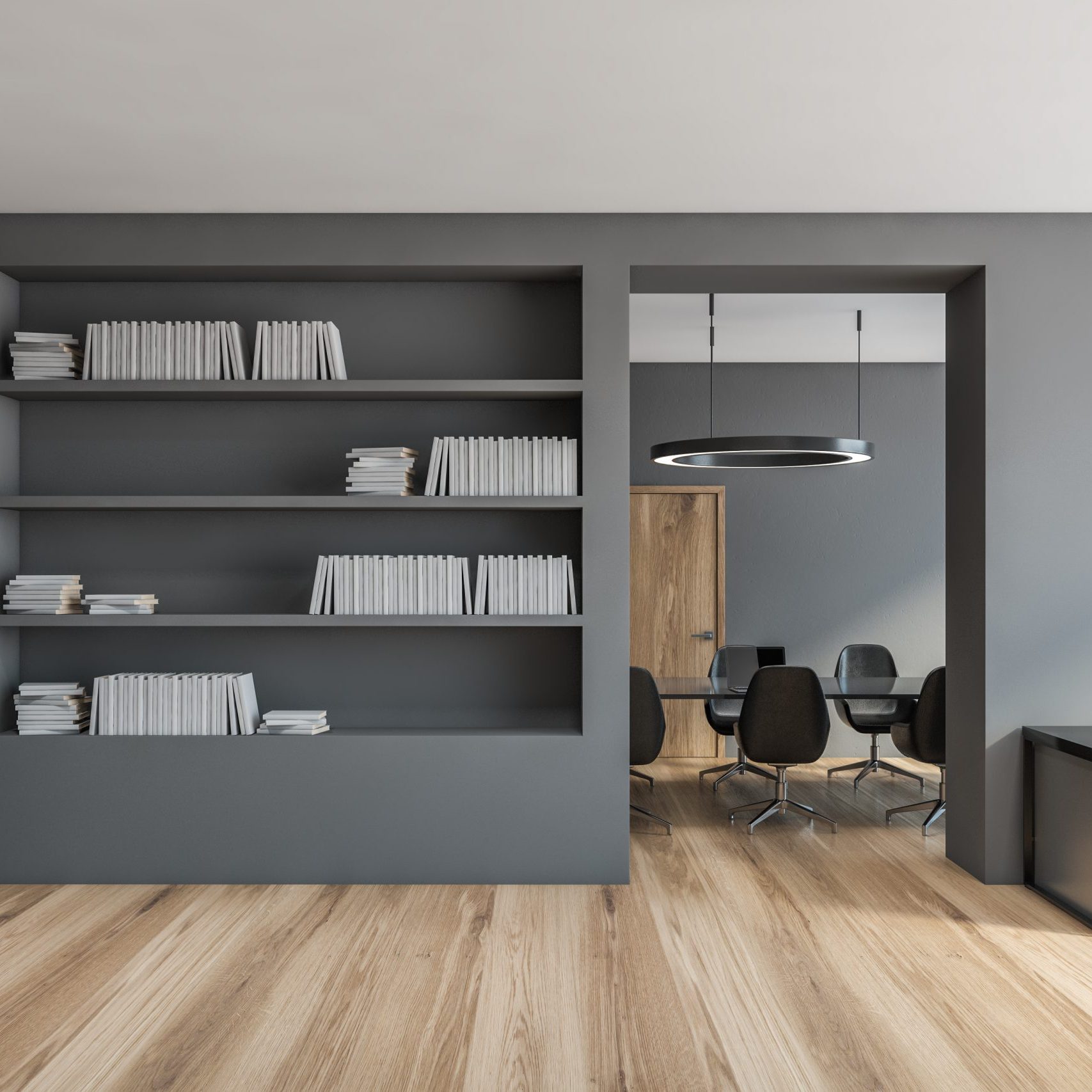Grey office room, big bookshelf and meeting room. Minimalist stylish dark interior of office with chairs and computer and lamp on the table, no people, 3D rendering